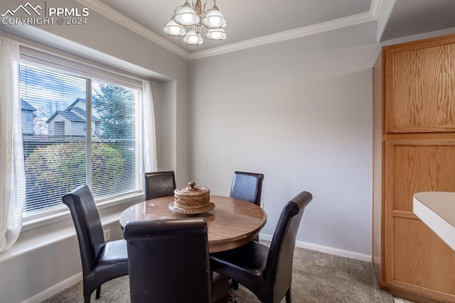 carpeted dining room with ornamental molding and an inviting chandelier