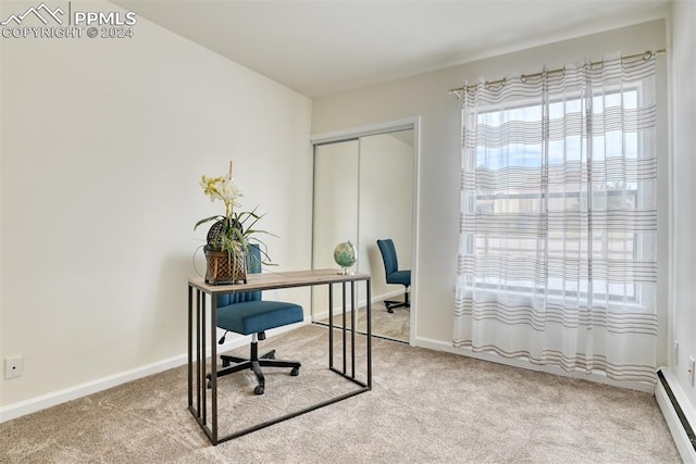 office area featuring carpet floors and baseboard heating