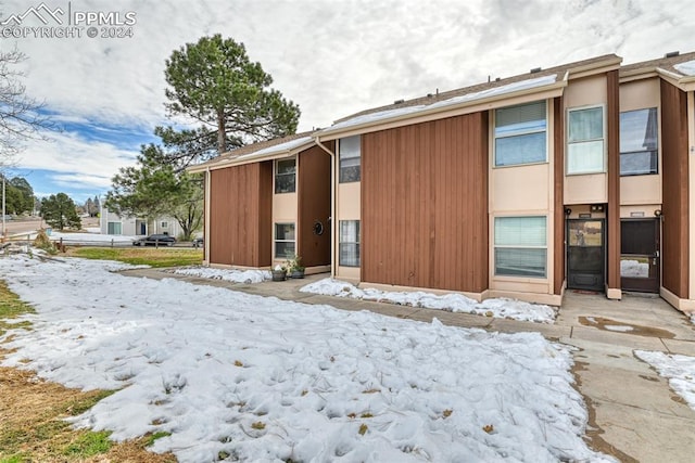 view of snow covered house