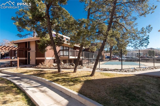 exterior space with tennis court