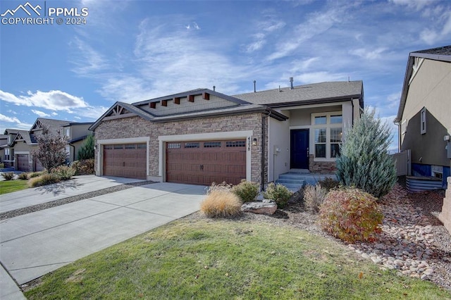 view of front of house with a front lawn and a garage