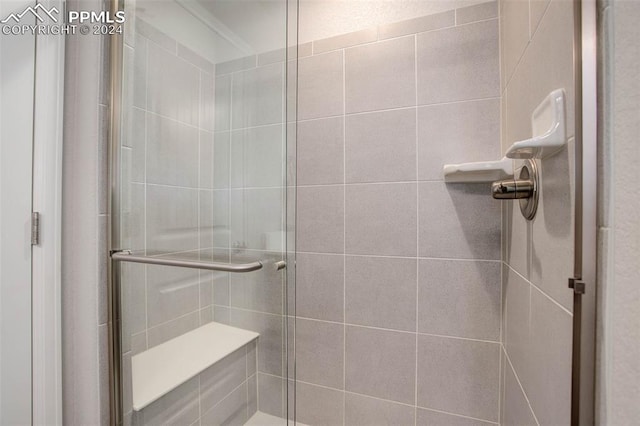 bathroom with a shower with shower door