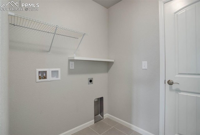 laundry area with washer hookup, light tile patterned floors, and electric dryer hookup