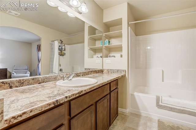 bathroom with vanity and shower / bath combination with curtain