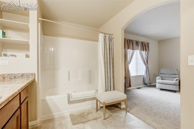 bathroom with vanity and shower / bathtub combination with curtain