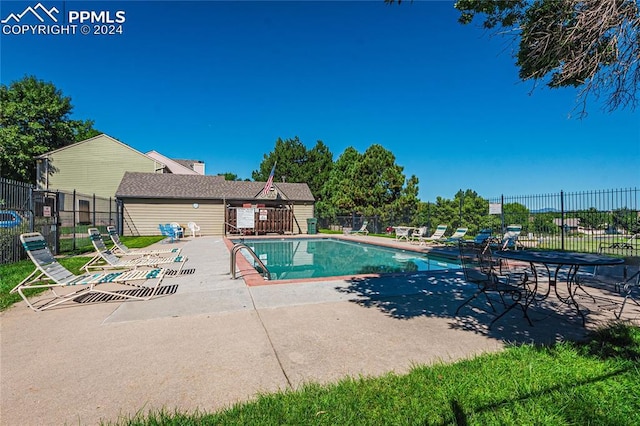 view of swimming pool featuring a patio area