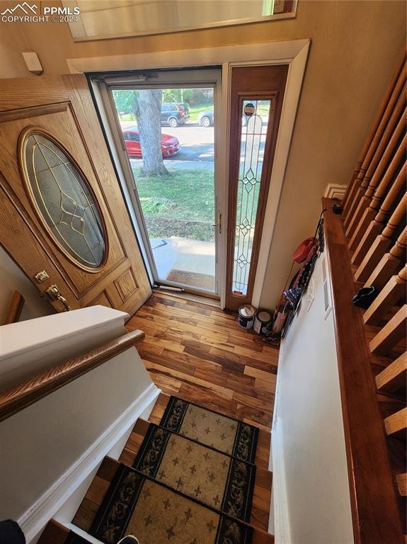 doorway to outside with hardwood / wood-style flooring