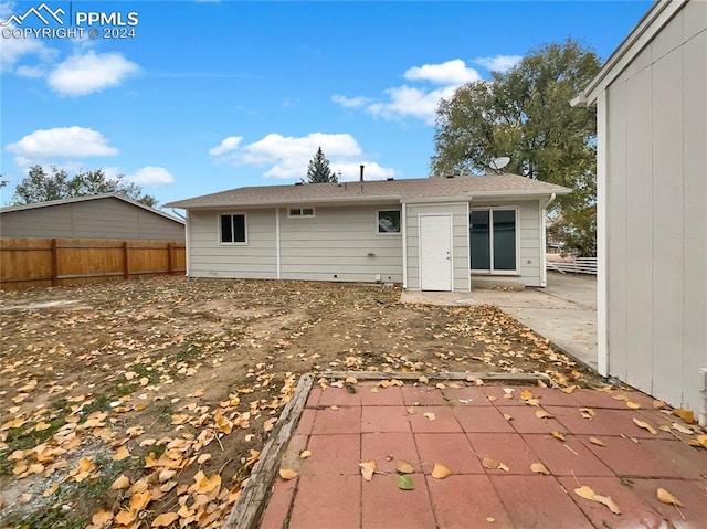 rear view of property featuring a patio area