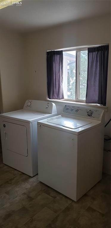 washroom with separate washer and dryer