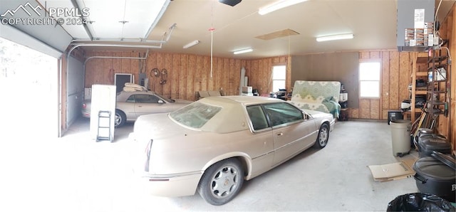 garage featuring wooden walls