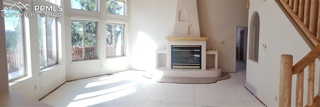 unfurnished living room featuring a fireplace