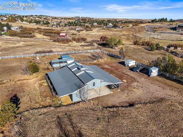 birds eye view of property featuring a rural view