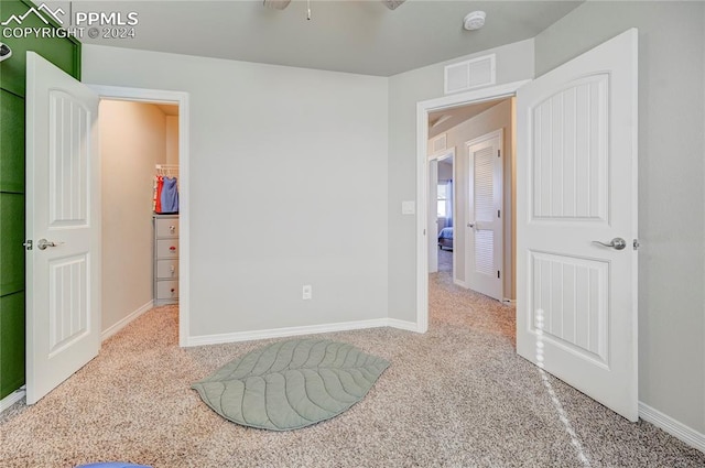 bedroom featuring light colored carpet