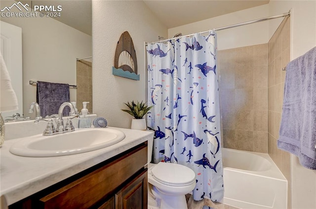 full bathroom with vanity, shower / bath combo, and toilet