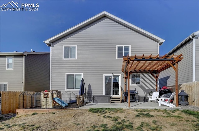 back of house featuring a pergola and a patio area