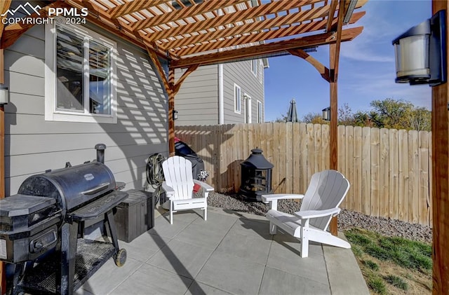 view of patio / terrace with grilling area and a pergola