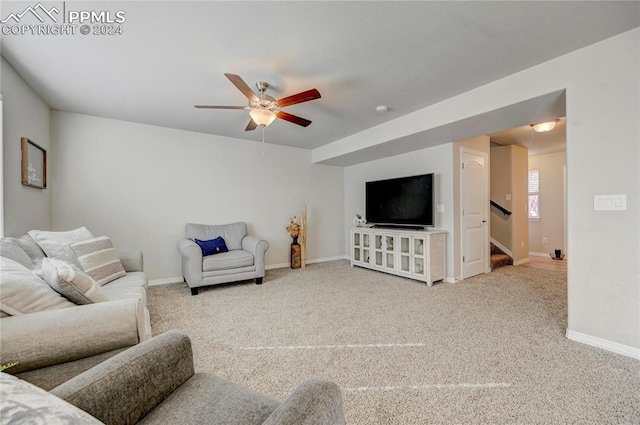 carpeted living room featuring ceiling fan