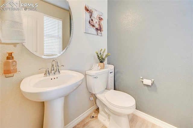 bathroom with toilet and sink