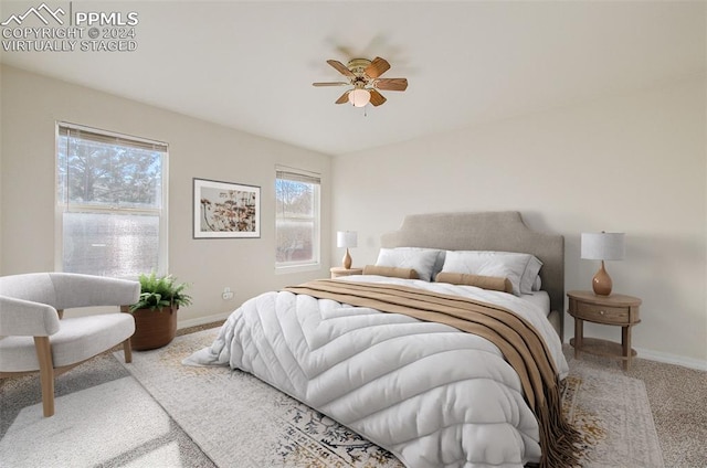 carpeted bedroom featuring ceiling fan