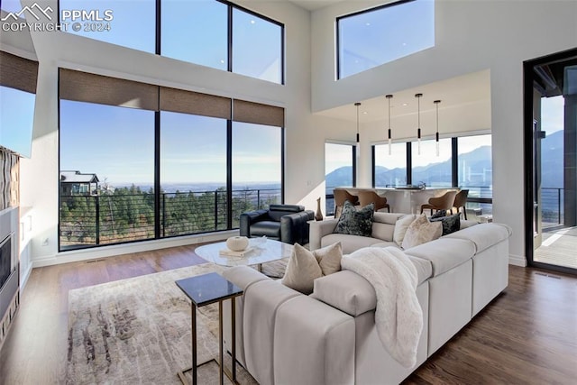 living area featuring wood finished floors and baseboards