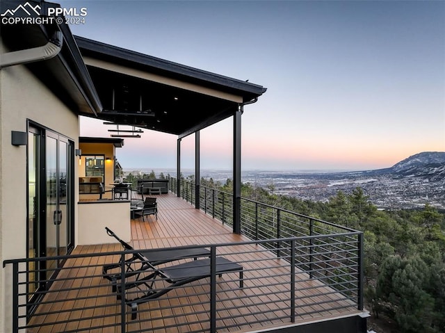 wooden deck featuring a mountain view