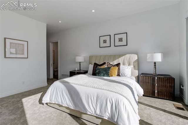 carpeted bedroom featuring baseboards, visible vents, and recessed lighting