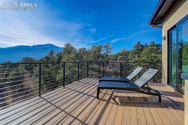 wooden terrace featuring a mountain view