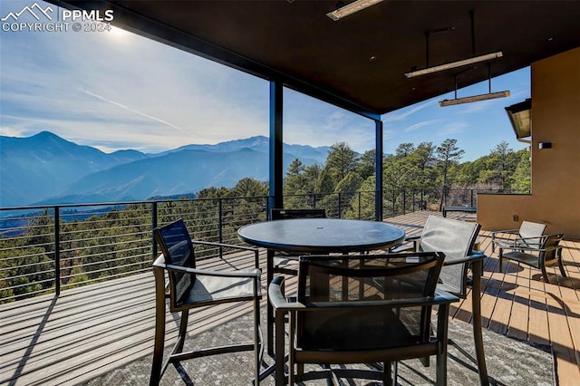 exterior space with outdoor dining area and a mountain view