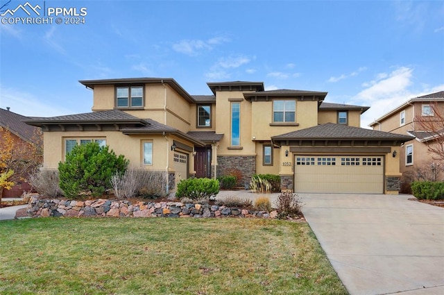 prairie-style home with a front yard