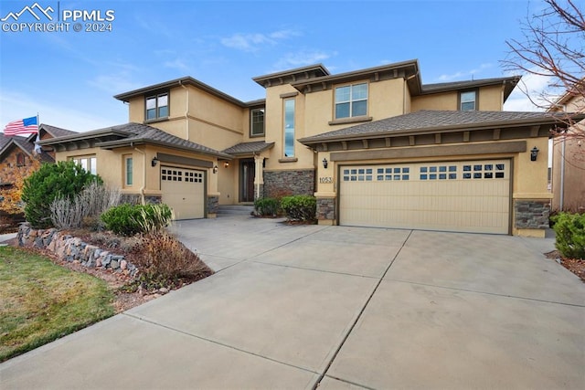 prairie-style house featuring a garage