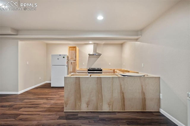 kitchen featuring stainless steel electric range, wall chimney range hood, white refrigerator, dark hardwood / wood-style flooring, and light brown cabinetry