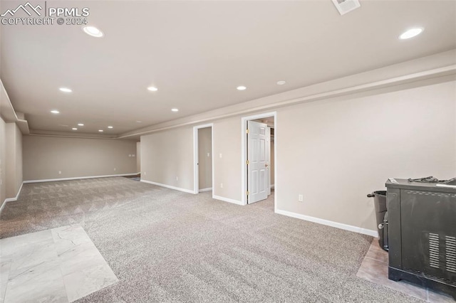 basement with carpet flooring