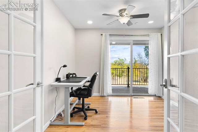 home office with french doors, light hardwood / wood-style flooring, and ceiling fan