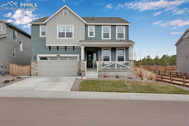 view of front of house with a garage and covered porch