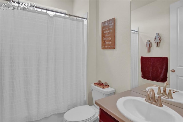 full bathroom with toilet, vanity, and shower / bath combination with curtain