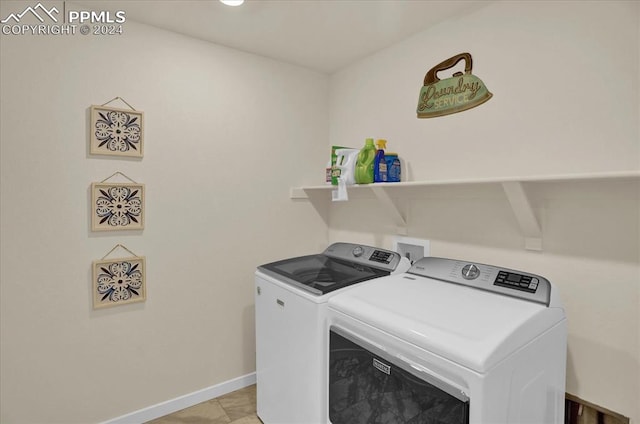 laundry room with washing machine and clothes dryer