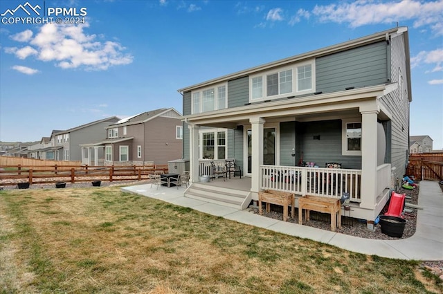 rear view of house with a lawn