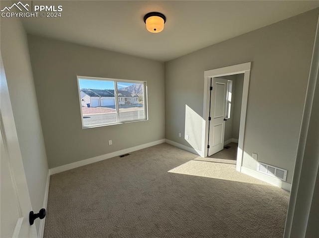 view of carpeted spare room