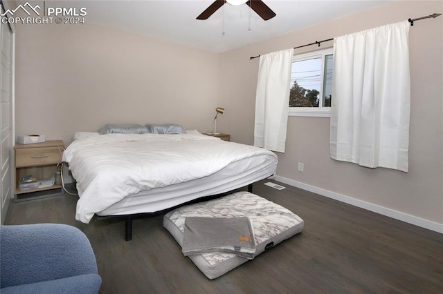 bedroom with dark wood-type flooring and ceiling fan