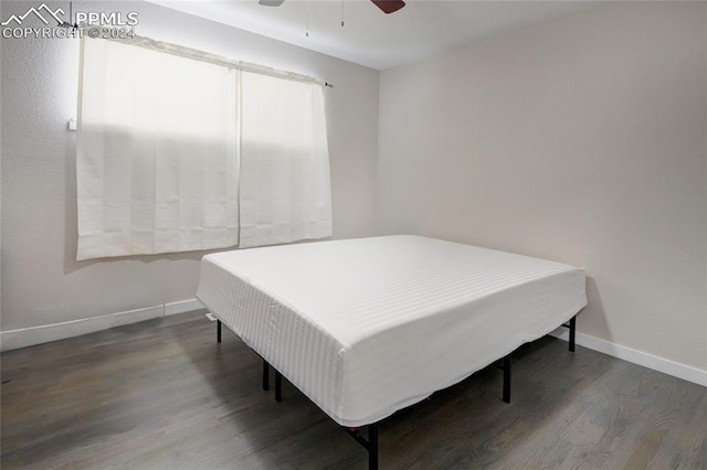 bedroom with dark wood-type flooring and ceiling fan