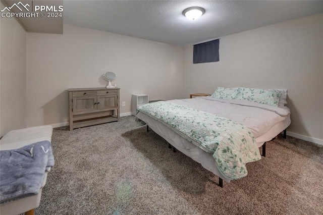 carpeted bedroom with a textured ceiling