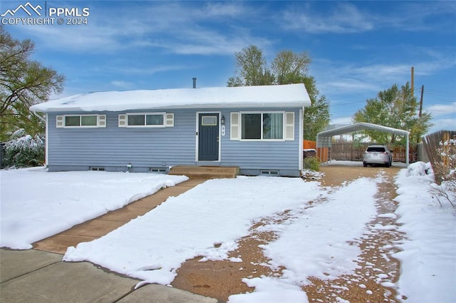 ranch-style home with a carport