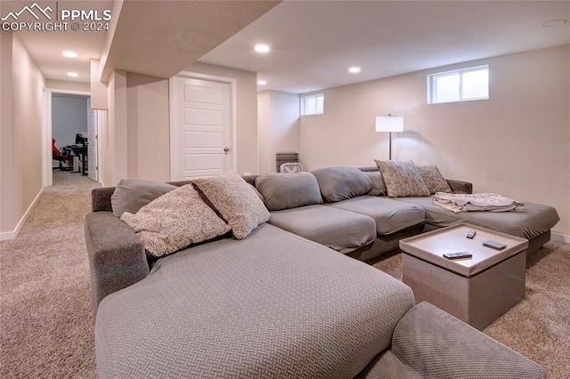 living room with plenty of natural light and light carpet