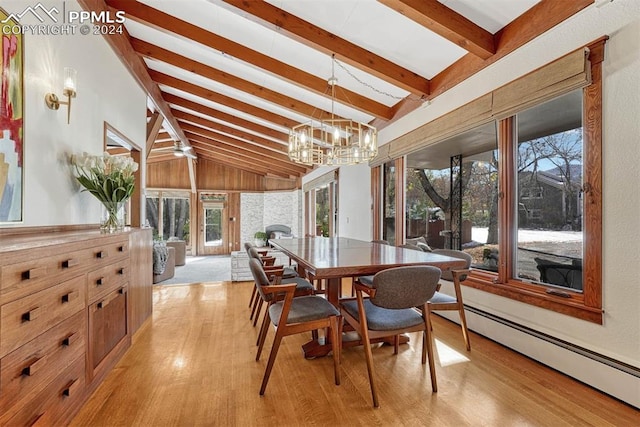 dining room featuring vaulted ceiling with beams, a baseboard heating unit, an inviting chandelier, and light hardwood / wood-style flooring