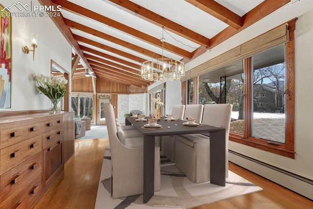 sunroom featuring vaulted ceiling with beams, a baseboard heating unit, and an inviting chandelier