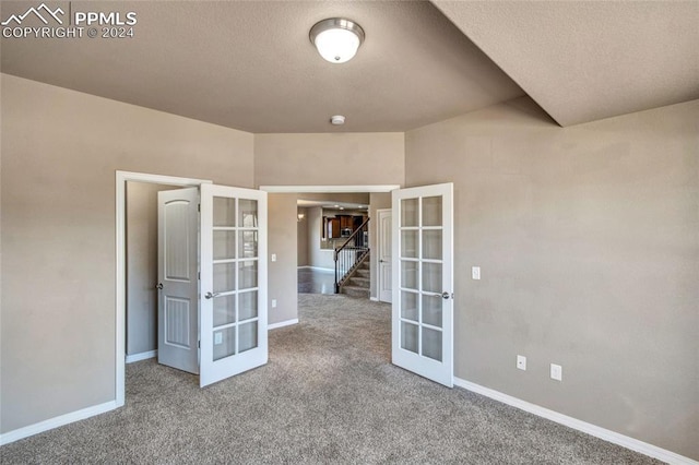 10978 Middlegate Ct, Peyton, CO 80831 - carpeted spare room with french doors, baseboards, and stairway