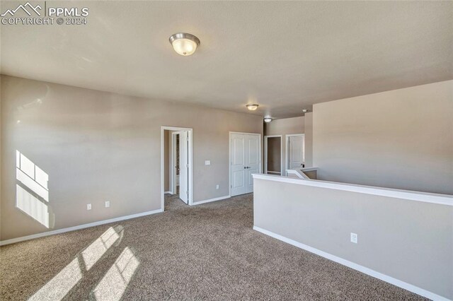 10978 Middlegate Ct, Peyton, CO 80831 - empty room featuring carpet floors and baseboards