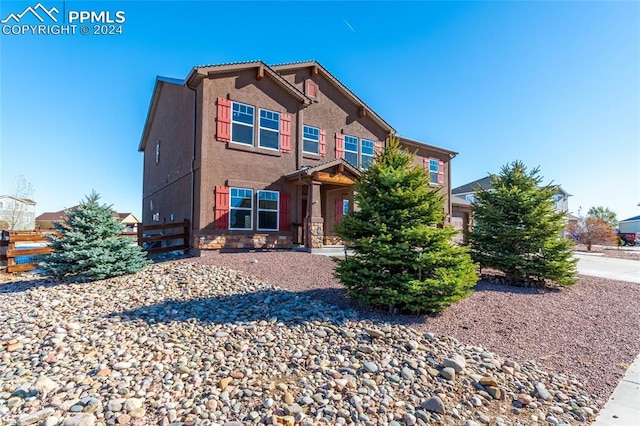 10978 Middlegate Ct, Peyton, CO 80831 - view of front of house with stone siding and stucco siding