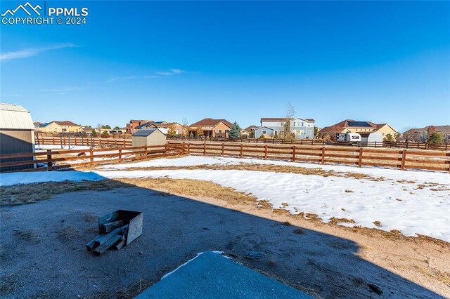 10978 Middlegate Ct, Peyton, CO 80831 - snowy yard with a residential view