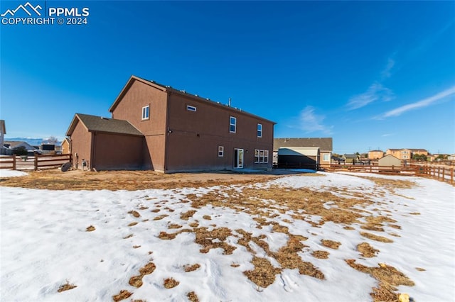 view of snow covered house